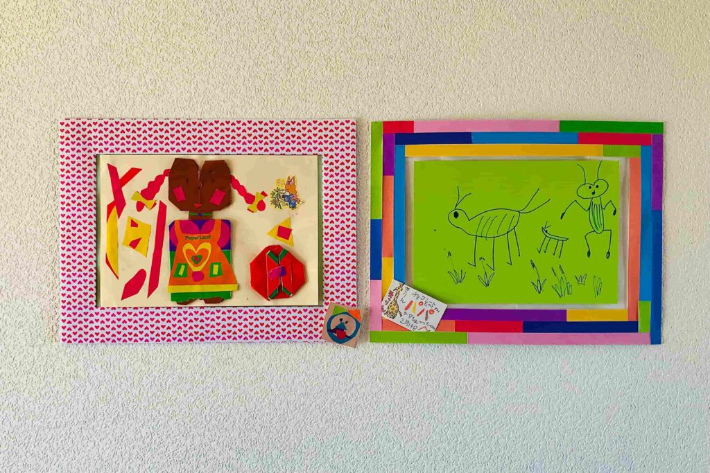 Sample photo of a handmade picture frame decorated with children's work.