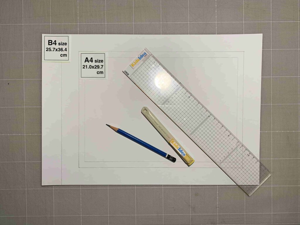 The scene where the pattern paper was drawn on the folded origami.Sample photos of materials and tools.